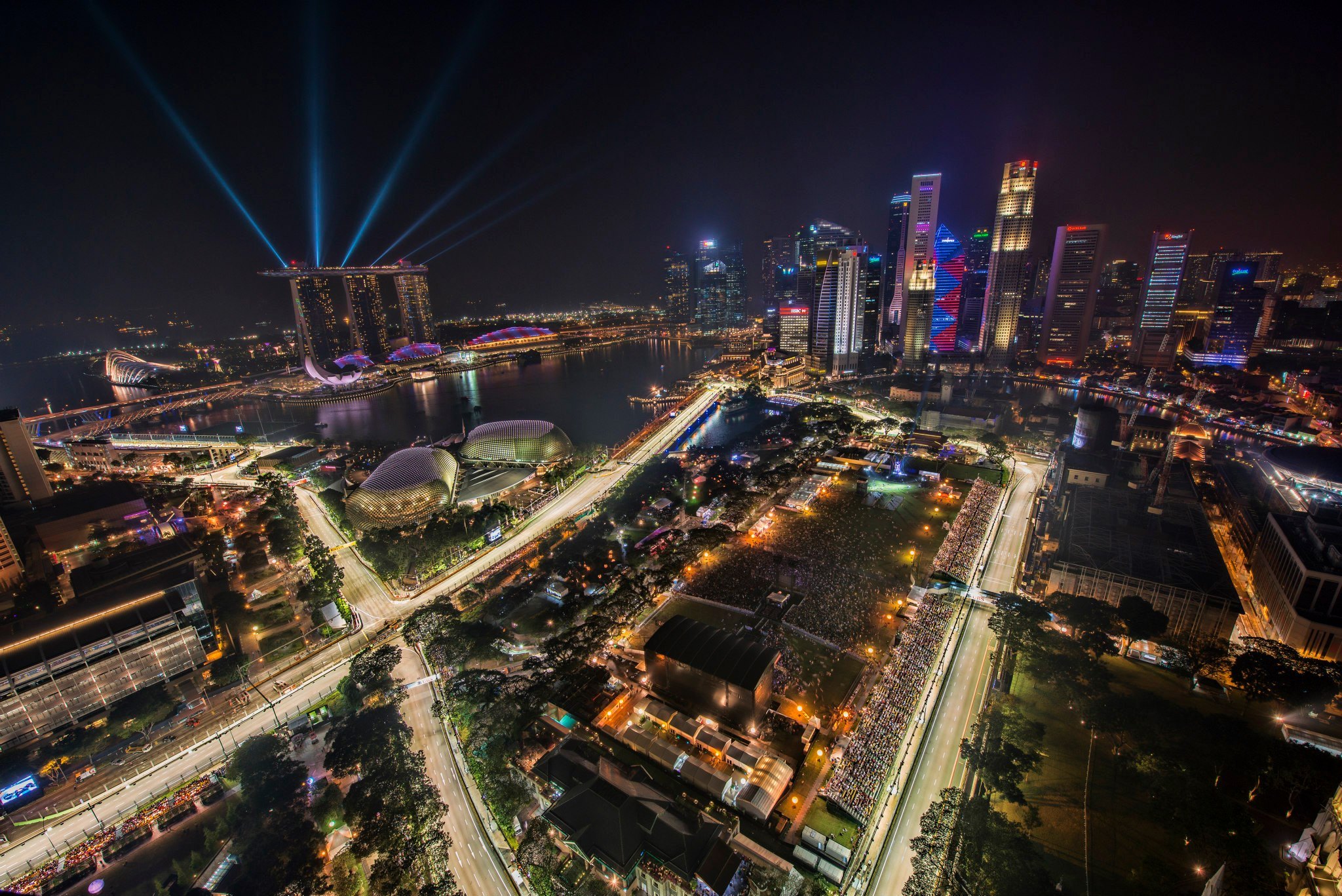 Night race at Marina Bay Street Circuit with the illuminated Singapore skyline